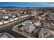 High-altitude aerial view of a community, showcasing the home's pool and surrounding landscape at 8445 S Tenaya Way, Las Vegas, NV 89113