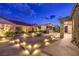 Inviting outdoor space featuring a built-in fire pit and kitchen perfect for entertaining at 8445 S Tenaya Way, Las Vegas, NV 89113