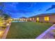 Backyard with artificial turf, featuring a private pool with covered pergola and exterior of the house at 8445 S Tenaya Way, Las Vegas, NV 89113