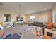 Versatile bonus room featuring a large sectional, play area, and plenty of room for activities at 8445 S Tenaya Way, Las Vegas, NV 89113