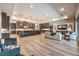 Stylish open living space with a large island, pendant lighting, ample seating, and modern finishes at 8445 S Tenaya Way, Las Vegas, NV 89113