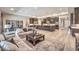 Expansive living space boasts an open floor plan with seamless flow to the kitchen, and neutral decor at 8445 S Tenaya Way, Las Vegas, NV 89113