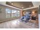 Serene main bedroom with tray ceiling, modern lighting, and large windows overlooking the backyard at 8445 S Tenaya Way, Las Vegas, NV 89113