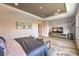 This bright main bedroom features tray ceilings, recessed lighting, and neutral walls and flooring at 8445 S Tenaya Way, Las Vegas, NV 89113