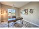 Comfortable home office features a modern desk, an ergonomic chair, and natural light at 8445 S Tenaya Way, Las Vegas, NV 89113