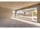 Covered patio reveals a built-in outdoor kitchen with ample counter space and a grill at 8445 S Tenaya Way, Las Vegas, NV 89113
