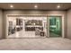 Seamless indoor-outdoor living with sliding glass doors to the home's stunning kitchen at 8445 S Tenaya Way, Las Vegas, NV 89113