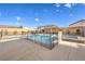 Refreshing pool with safety fence, ideal for Gathering enjoyment and relaxation during warm weather at 8445 S Tenaya Way, Las Vegas, NV 89113