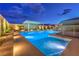 Stunning pool and spa area with a pergola and ambient lighting, perfect for evening relaxation at 8445 S Tenaya Way, Las Vegas, NV 89113