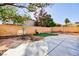 Enjoy the backyard oasis with concrete patio, desert landscaping, and shade trees at 8617 Copper Ridge Ave, Las Vegas, NV 89129