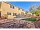 Lush backyard with stone accents, patio area, and mature landscaping for outdoor enjoyment at 8617 Copper Ridge Ave, Las Vegas, NV 89129