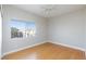 Bedroom featuring hardwood floors, ceiling fan, and natural light from the window at 8617 Copper Ridge Ave, Las Vegas, NV 89129