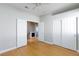Bedroom with wood floor and an open doorway to an additional living space at 8617 Copper Ridge Ave, Las Vegas, NV 89129