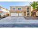 Two-story home featuring a desert landscape, three-car garage and well-maintained lawn at 8617 Copper Ridge Ave, Las Vegas, NV 89129