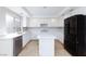 Modern kitchen featuring white cabinets, quartz countertops, stainless steel appliances, and a kitchen island at 8617 Copper Ridge Ave, Las Vegas, NV 89129