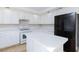 Modern kitchen featuring white cabinets, quartz countertops, stainless steel appliances, and a kitchen island at 8617 Copper Ridge Ave, Las Vegas, NV 89129