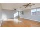 Spacious living room with hardwood floors, recessed lighting, ceiling fans, and large windows with natural light at 8617 Copper Ridge Ave, Las Vegas, NV 89129
