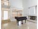 Light filled living room with neutral paint, tile flooring, high ceilings and fireplace at 8617 Copper Ridge Ave, Las Vegas, NV 89129