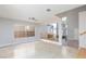 Living Room with high ceilings, neutral paint, tile flooring, staircase and a large window at 8617 Copper Ridge Ave, Las Vegas, NV 89129