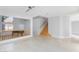 Bright living room with tile flooring, neutral paint, high ceilings and a staircase at 8617 Copper Ridge Ave, Las Vegas, NV 89129