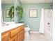 Bathroom with tile floors, shower, and wood vanity at 8777 W Maule Ave # 1087, Las Vegas, NV 89148