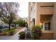 Exterior of the building with well-maintained landscaping, including greenery and a sidewalk at 8777 W Maule Ave # 1087, Las Vegas, NV 89148