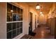 Hallway view of the Fitness Center entrance, featuring exterior bench seating, and lighting at 8777 W Maule Ave # 1087, Las Vegas, NV 89148