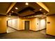 An interior hallway with neutral paint colors, carpeted floors, and directional signage at 8777 W Maule Ave # 1087, Las Vegas, NV 89148