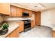 Spacious kitchen with stainless steel appliances and wood cabinets at 8777 W Maule Ave # 1087, Las Vegas, NV 89148