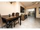 Bright living room with a rustic dining table and modern entertainment center at 8777 W Maule Ave # 1087, Las Vegas, NV 89148