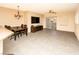 Open-concept living room featuring tile flooring, a dining area, and a sliding glass door for natural light at 8777 W Maule Ave # 1087, Las Vegas, NV 89148