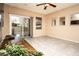 This bright living room offers a sliding glass door to a patio and tile flooring at 8777 W Maule Ave # 1087, Las Vegas, NV 89148