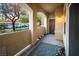 Charming covered patio with neutral tones and a serene view of the community's landscape and resident parking at 8777 W Maule Ave # 1087, Las Vegas, NV 89148