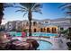 Community pool featuring poolside chairs, a hot tub, and a nearby palm tree, offering a resort-style experience at 8777 W Maule Ave # 1087, Las Vegas, NV 89148