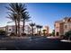 A picturesque street view with palm trees lining the road, showcasing the community's well-maintained landscaping at 8777 W Maule Ave # 1087, Las Vegas, NV 89148