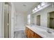 Bright bathroom featuring a double sink vanity, and shower-tub combo at 8787 Tom Noon Ave # 101, Las Vegas, NV 89178