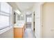 Bright bathroom featuring a double sink vanity, and walk in closet access at 8787 Tom Noon Ave # 101, Las Vegas, NV 89178
