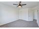 Neutral bedroom featuring carpet, ceiling fan, and a closet at 8787 Tom Noon Ave # 101, Las Vegas, NV 89178