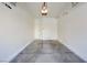 Clean, empty one-car garage with a painted floor, equipped with overhead lighting and functional storage hooks at 8787 Tom Noon Ave # 101, Las Vegas, NV 89178