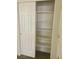 Pantry closet with adjustable shelving behind a sliding door, maximizing storage space for household goods at 8787 Tom Noon Ave # 101, Las Vegas, NV 89178