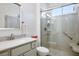 Modern bathroom featuring a walk-in shower, updated vanity, and grab bar at 9000 Sundial Dr, Las Vegas, NV 89134