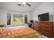 Bedroom with ample natural light, workstation, and large dresser at 9000 Sundial Dr, Las Vegas, NV 89134