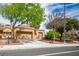 Charming single-story home with a well-maintained front yard, mature trees, and a two-car garage at 9000 Sundial Dr, Las Vegas, NV 89134