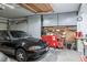 Well-organized garage with storage cabinets, tool chest, and pegboard at 9000 Sundial Dr, Las Vegas, NV 89134