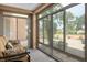Bright sunroom featuring large windows offering lots of natural light and a comfortable seating area at 9000 Sundial Dr, Las Vegas, NV 89134