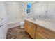 Clean bathroom with a tub, modern vanity, and neutral finishes at 9267 Lapeer St, Las Vegas, NV 89178