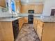 Updated kitchen with granite countertops and stainless steel appliances at 9267 Lapeer St, Las Vegas, NV 89178