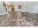 Spacious living area featuring tile flooring adjacent to the kitchen at 9267 Lapeer St, Las Vegas, NV 89178
