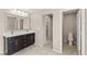Bathroom with a double sink vanity and access to a separate toilet room at 9277 Ardoa Ave, Las Vegas, NV 89148