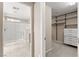 Bathroom featuring a glass enclosed shower and easy access to a large closet at 9277 Ardoa Ave, Las Vegas, NV 89148